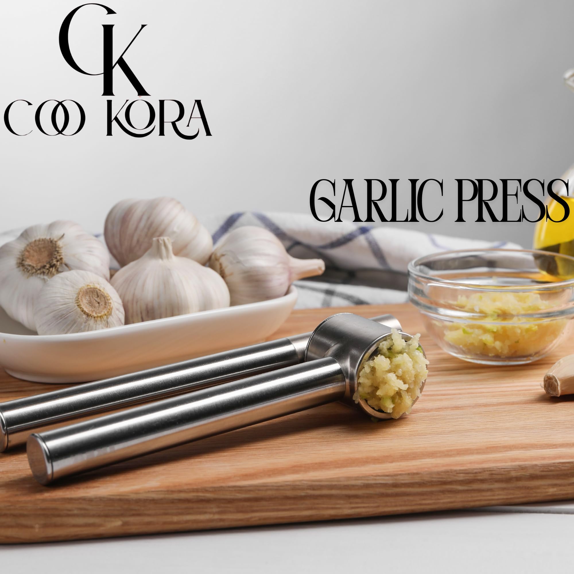 COO KORA Heavy Duty Garlic Press, Handheld Garlic Mincer, 304 Stainless Steel Garlic Press, Ergonomic, Durable, No Hand Odor, Just Put It in the Bowl, Dishwasher Safe
